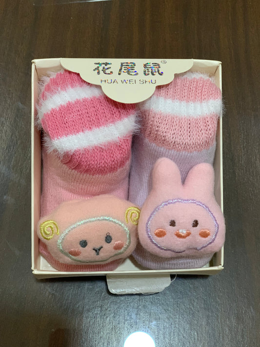 Two pairs of character woolen socks 6 to 12 months